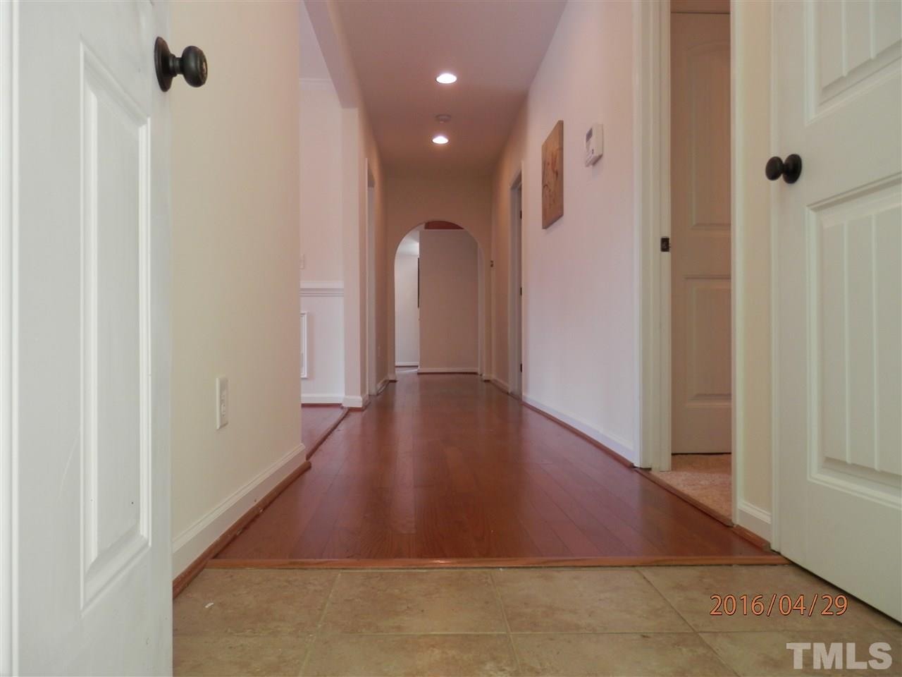 817 East Davie Street Raleigh, NC 27601 - Photo 2 of 25 a view of a hallway with wooden floor