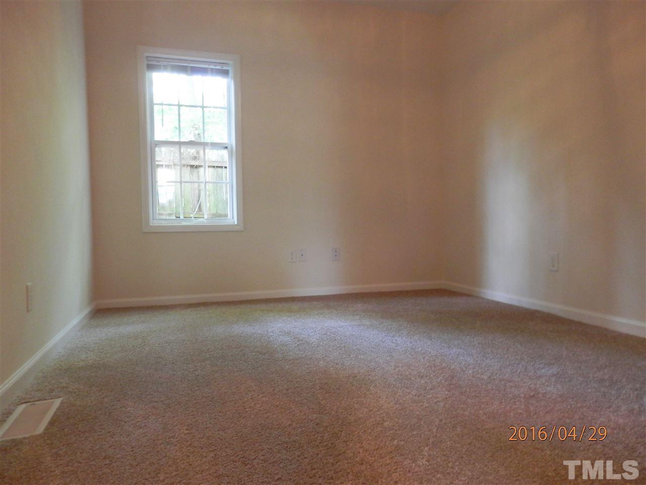 817 East Davie Street Raleigh, NC 27601 - Photo 19 of 25 an empty room with a window