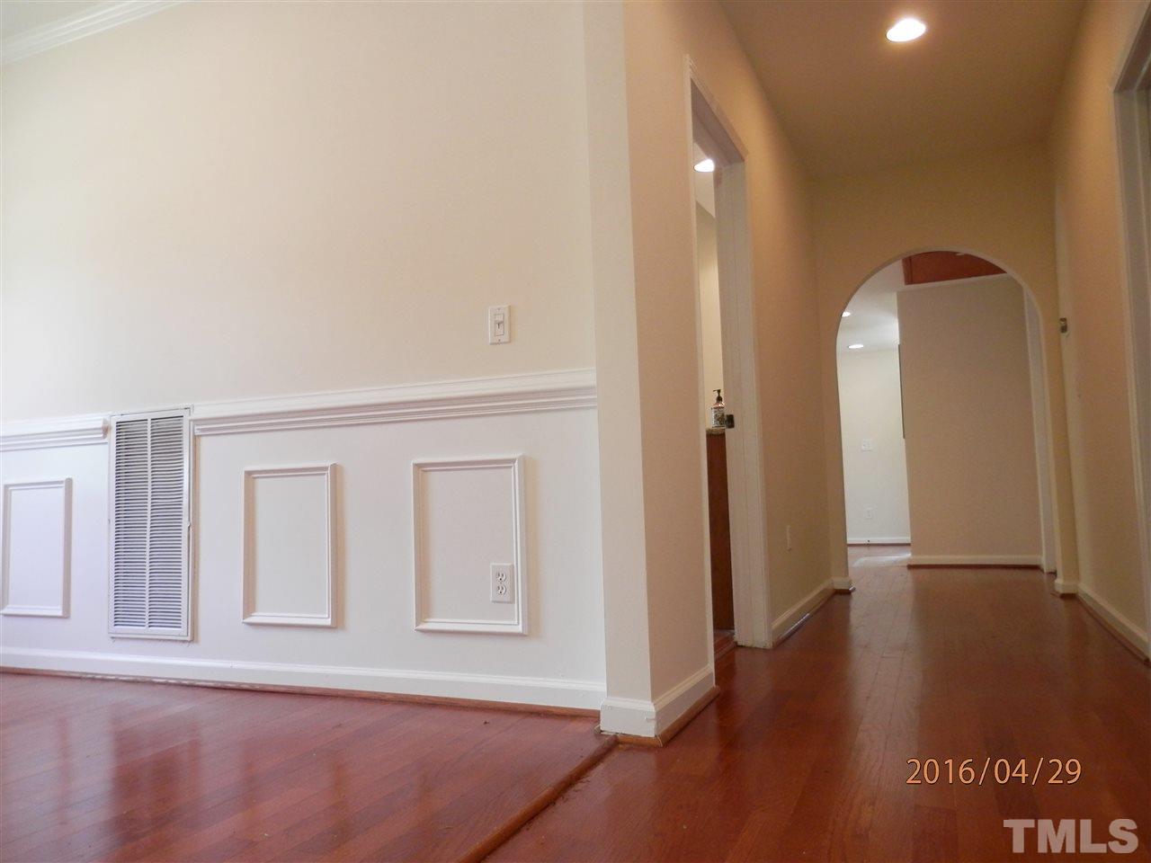 817 East Davie Street Raleigh, NC 27601 - Photo 7 of 25 an entryway of a house with wooden floor