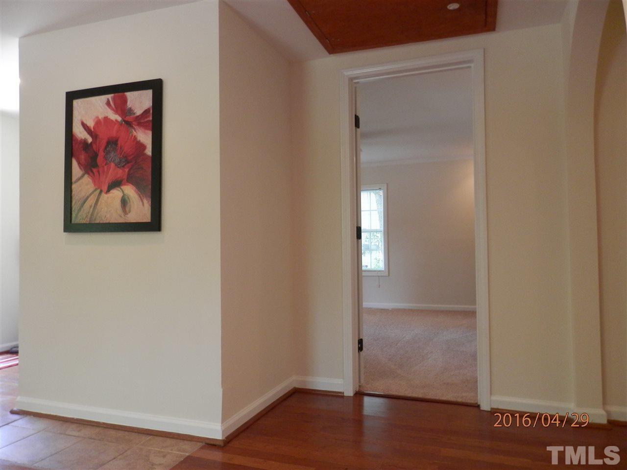 817 East Davie Street Raleigh, NC 27601 - Photo 8 of 25 a view of a hallway with wooden floor