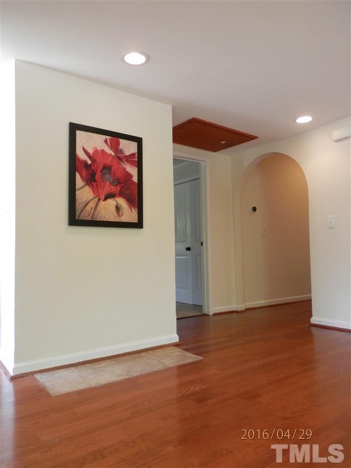 817 East Davie Street Raleigh, NC 27601 - Photo 10 of 25 a view of an empty room with a painting on the wall