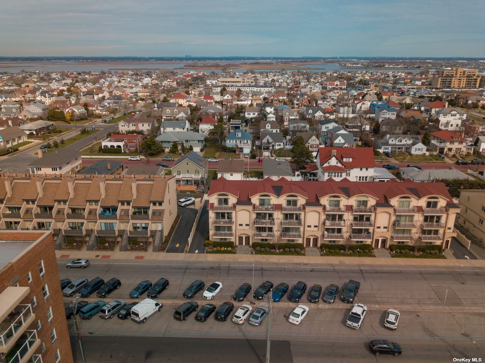 an aerial view of a building with parking