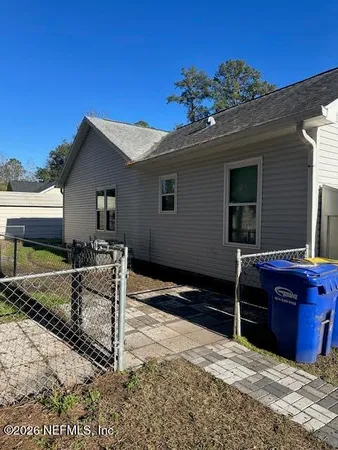 a view of house with yard