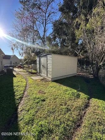 a view of a backyard of the house
