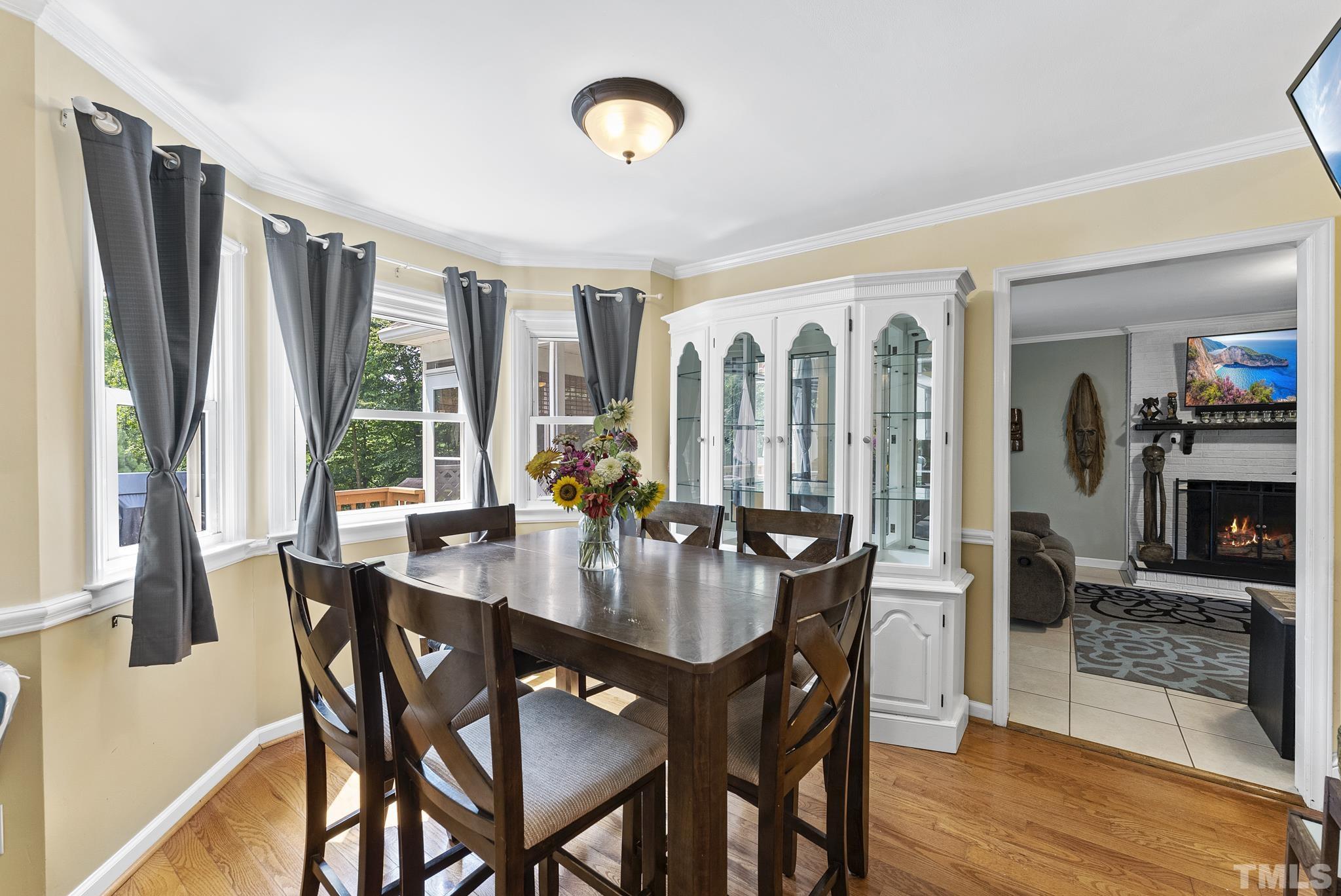 524 Jericho Road Hillsborough, NC 27278 - Photo 12 of 52 a view of a dining room with furniture window and wooden floor