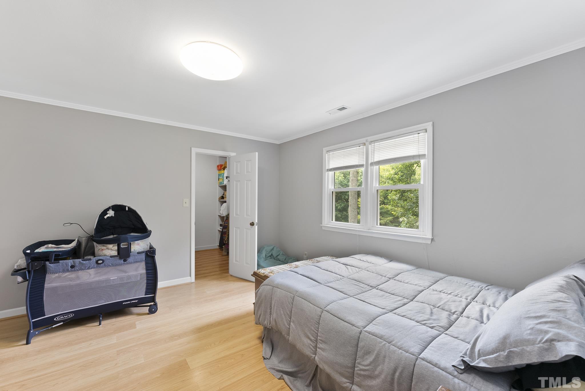 524 Jericho Road Hillsborough, NC 27278 - Photo 13 of 52 a bedroom with a bed and a window