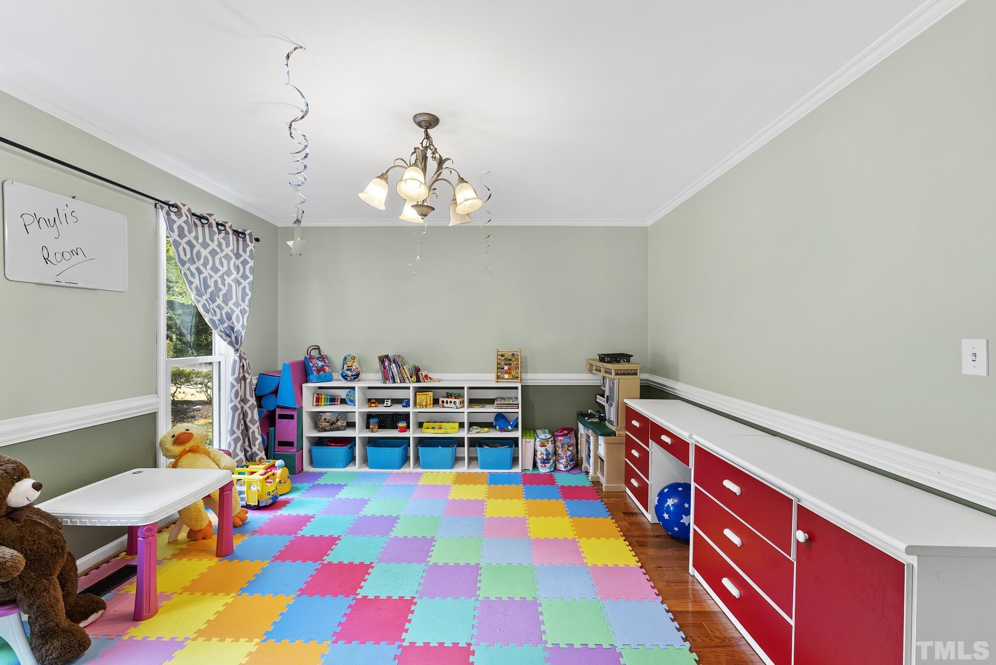 524 Jericho Road Hillsborough, NC 27278 - Photo 25 of 52 a room with a baby crib and a chair