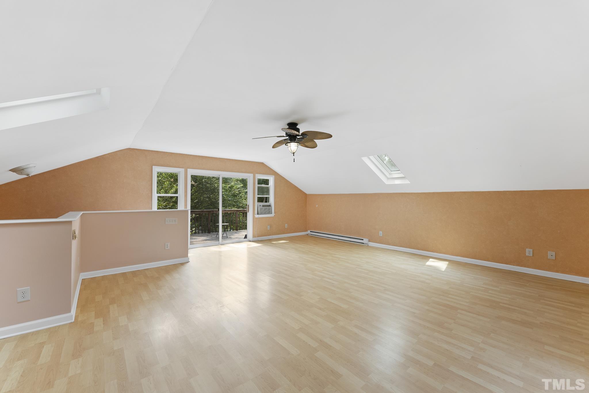 524 Jericho Road Hillsborough, NC 27278 - Photo 29 of 52 an empty room with wooden floor and windows