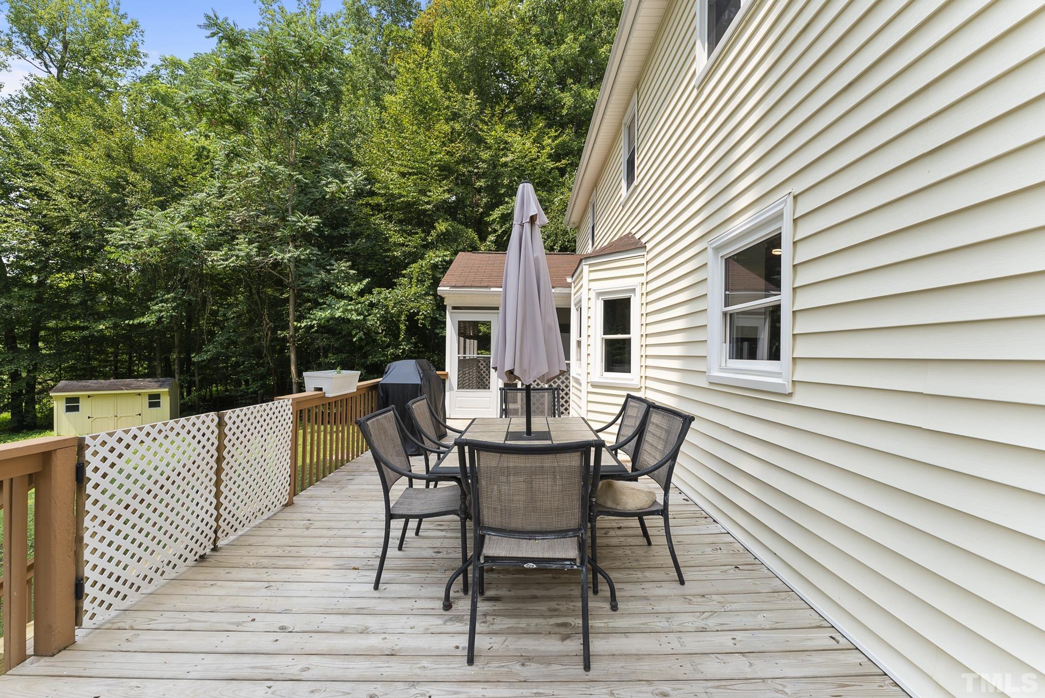 524 Jericho Road Hillsborough, NC 27278 - Photo 34 of 52 a view of a roof deck with table and chairs and wooden floor