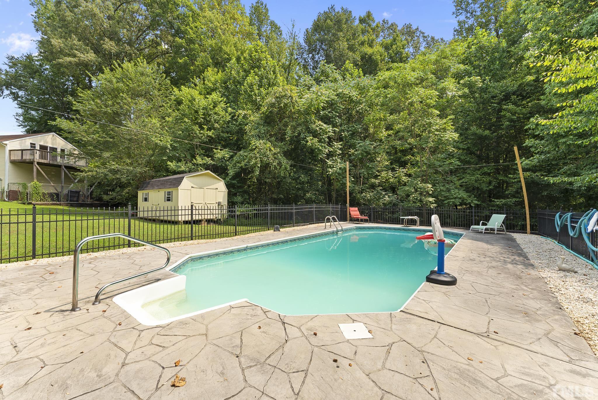 524 Jericho Road Hillsborough, NC 27278 - Photo 41 of 52 a view of a backyard with swimming pool