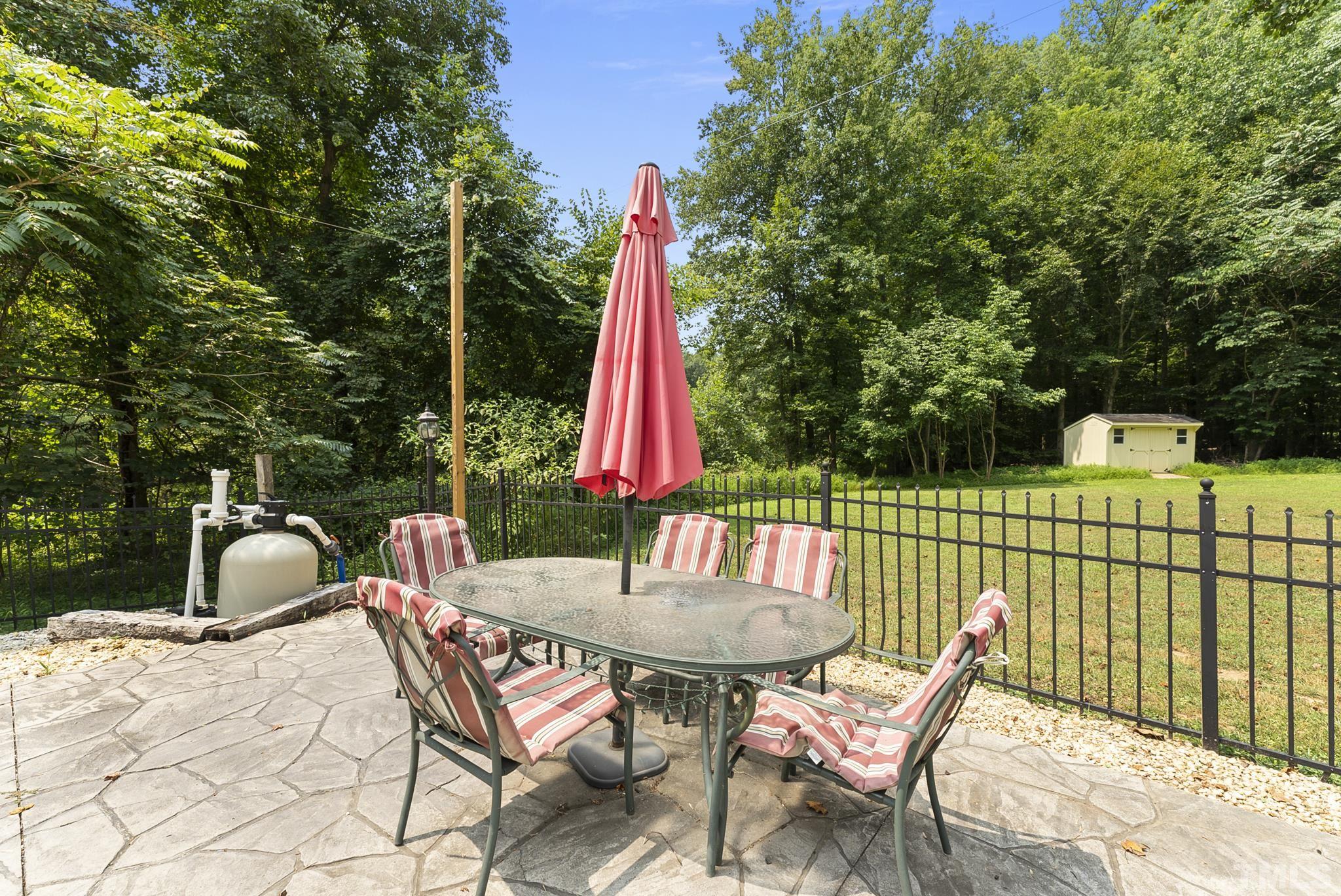 524 Jericho Road Hillsborough, NC 27278 - Photo 43 of 52 a view of a patio with a table and chairs