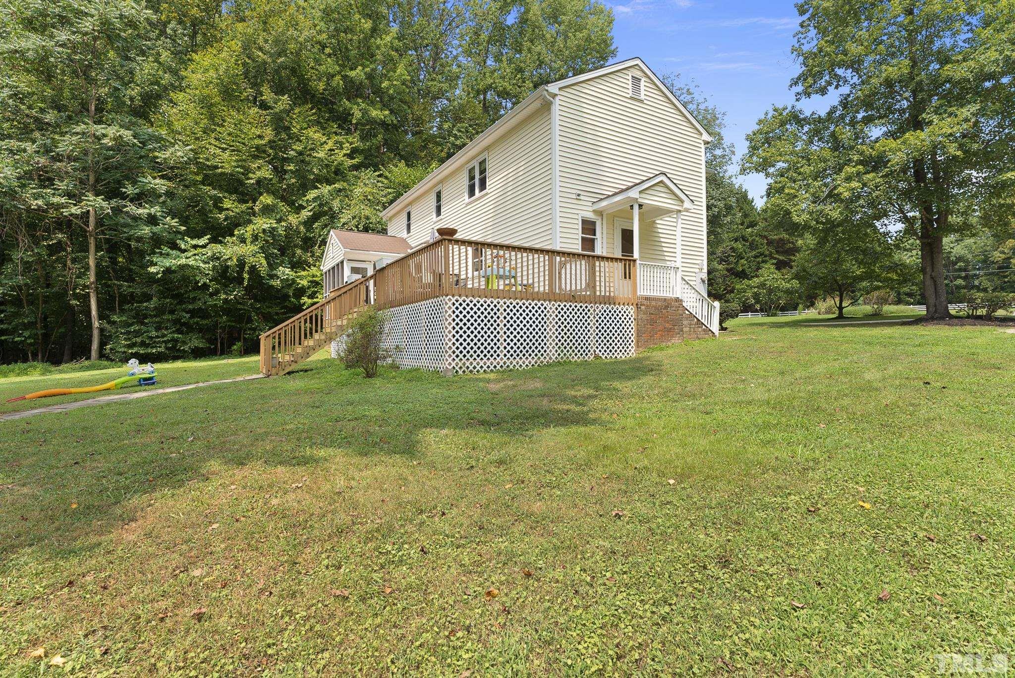524 Jericho Road Hillsborough, NC 27278 - Photo 45 of 52 a view of a house with a yard