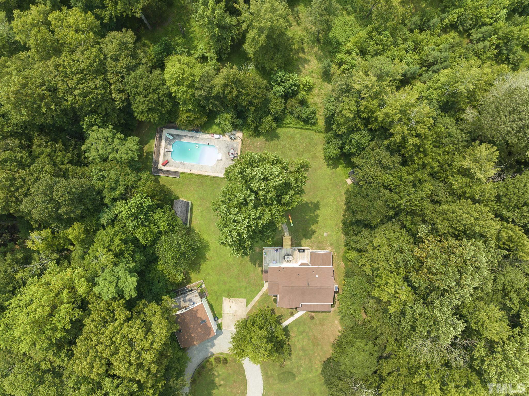 524 Jericho Road Hillsborough, NC 27278 - Photo 47 of 52 a backyard of a house with a yard and outdoor seating