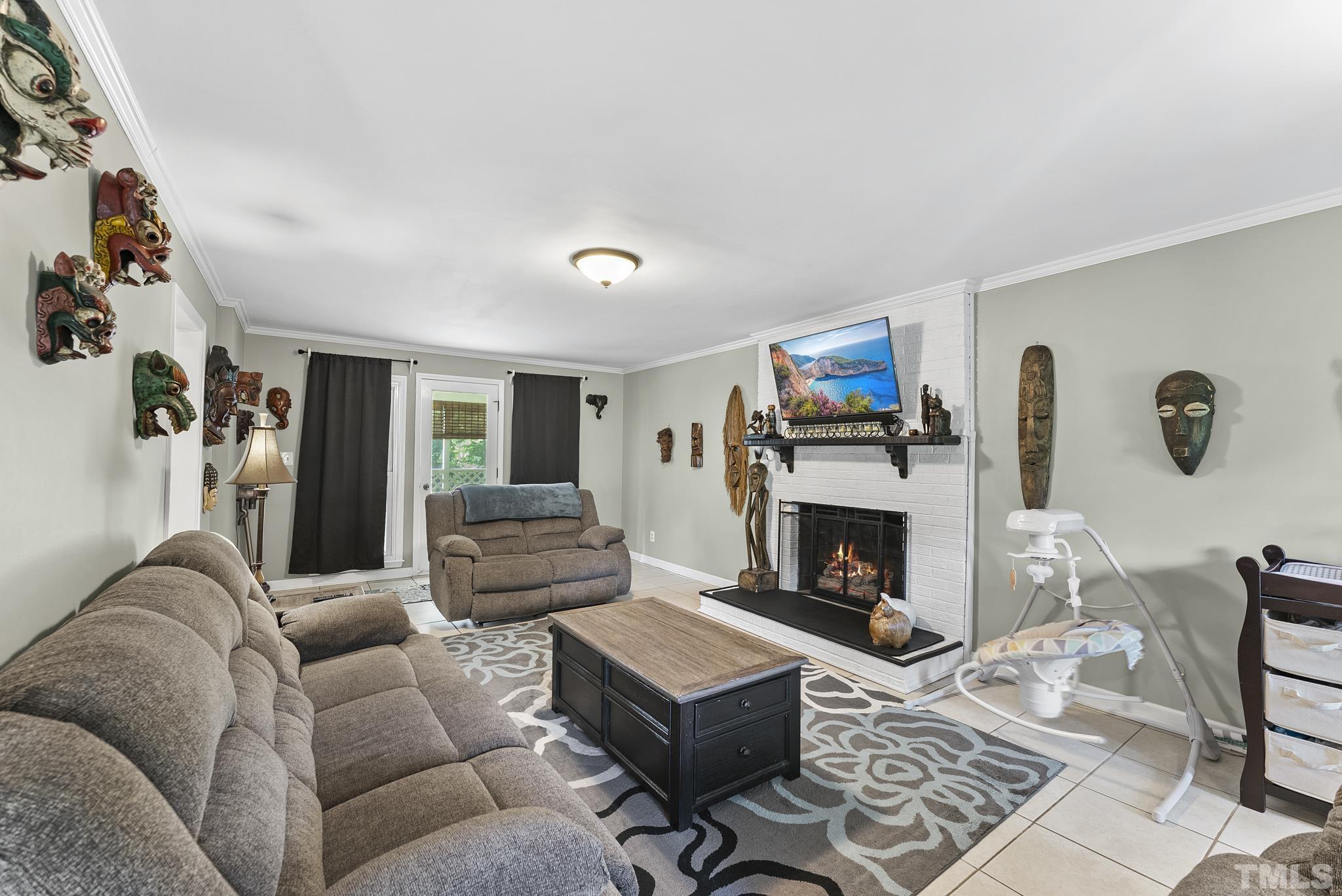 524 Jericho Road Hillsborough, NC 27278 - Photo 6 of 52 a living room with furniture and a fireplace