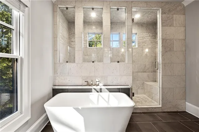 a kitchen with stainless steel appliances a refrigerator sink and microwave