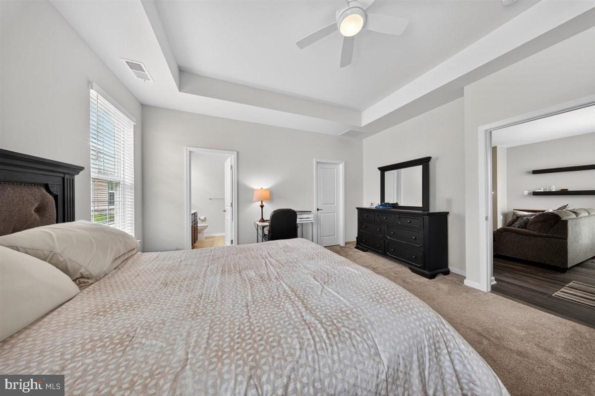 1426 Whispering Woods Road Middletown, DE 19709 - Photo 14 of 37 a bedroom with a bed and a couch