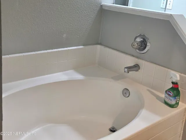 a view of storage and utility room with wooden floor