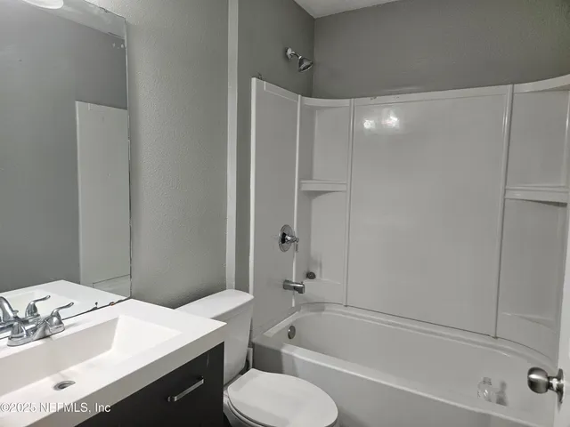 a view of a park with swings and slides