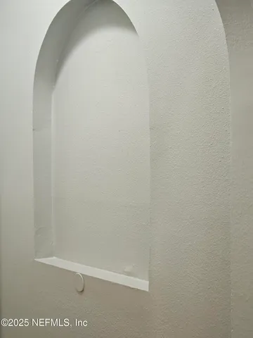 a kitchen with window and wooden floor