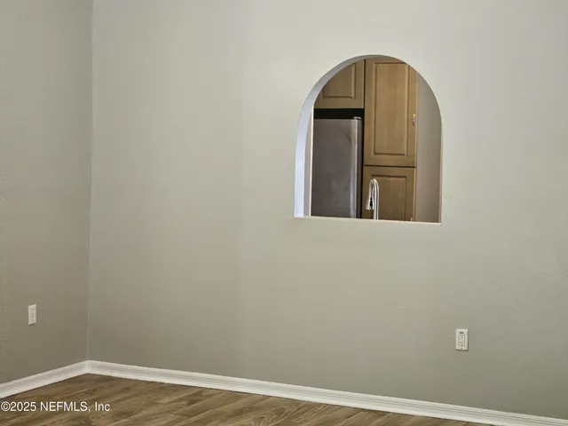 a kitchen with granite countertop a sink stainless steel appliances and cabinets