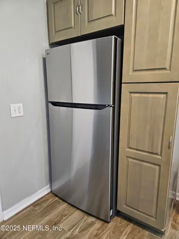 a bathroom with a tub and a window