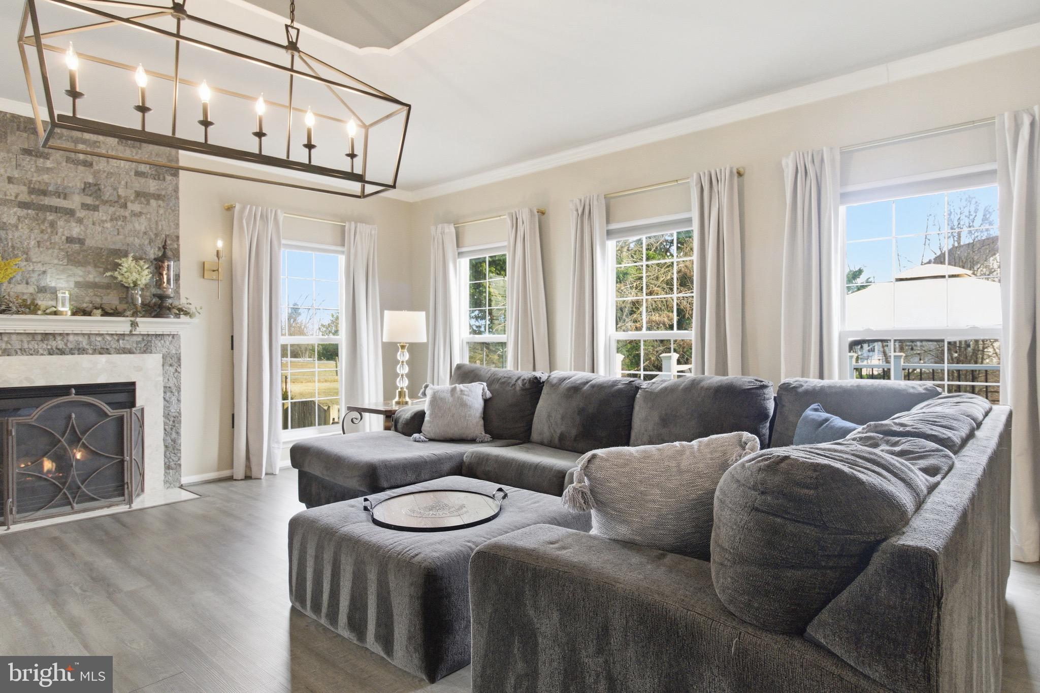 720 Vista Ridge Drive Northeast Leesburg, VA 20176 - Photo 13 of 61 Family room with natural light & so many windows