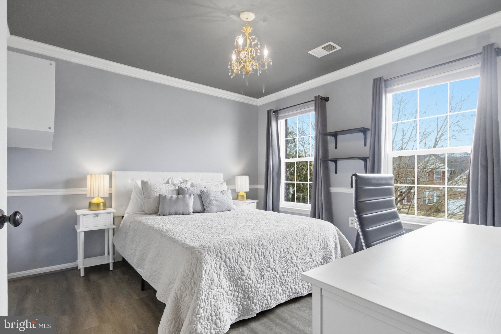 720 Vista Ridge Drive Northeast Leesburg, VA 20176 - Photo 24 of 61 Bedroom 2 w/ chandelier, newer LVP flooring