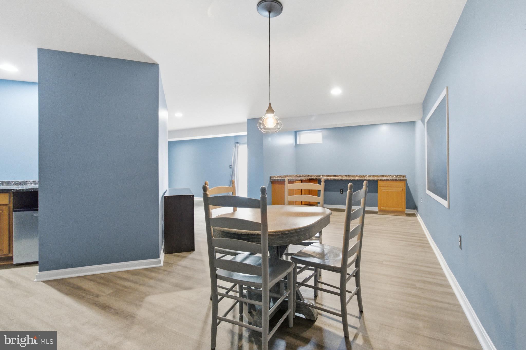 720 Vista Ridge Drive Northeast Leesburg, VA 20176 - Photo 28 of 61 Lower level entertaining area & newer LVP flooring