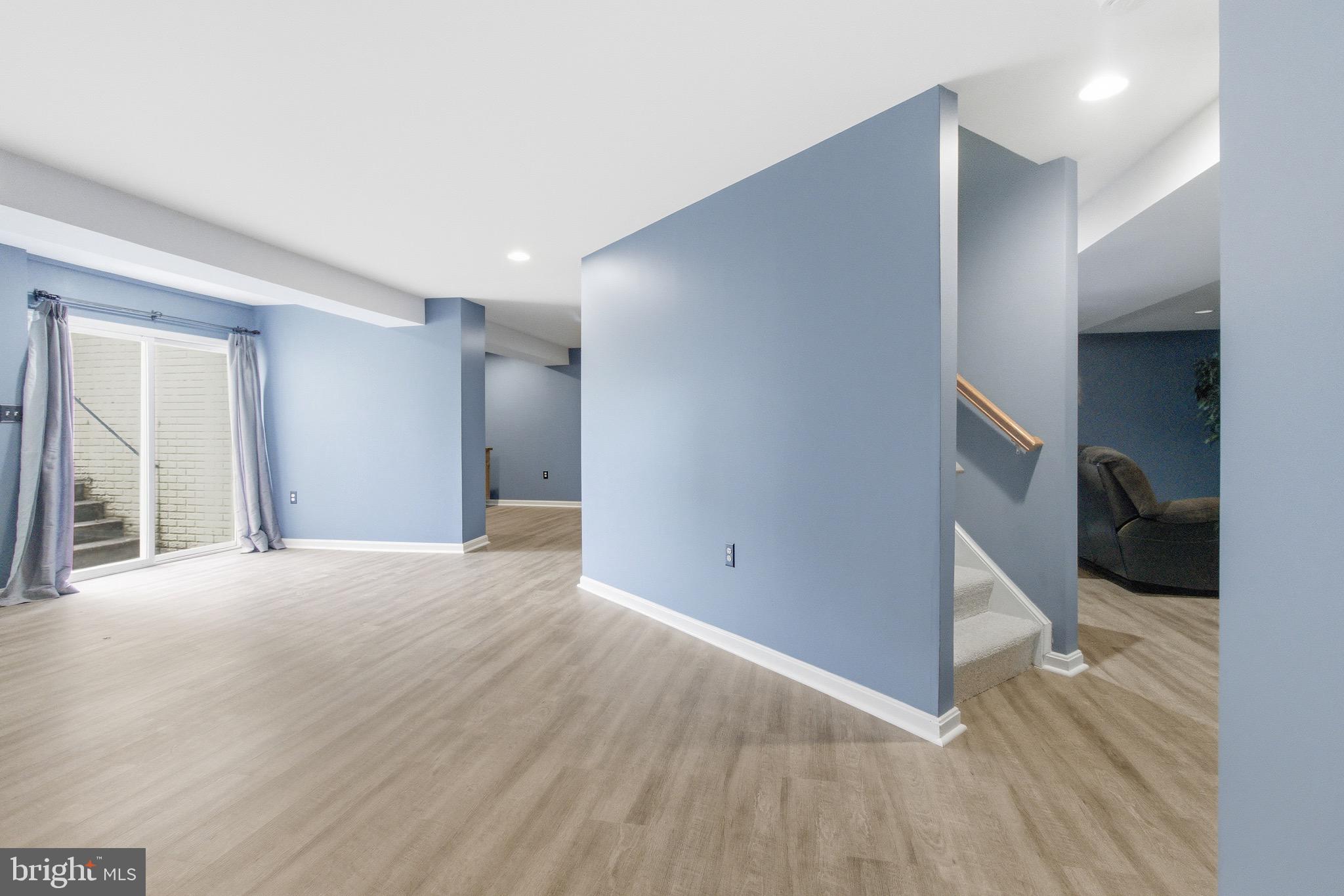 720 Vista Ridge Drive Northeast Leesburg, VA 20176 - Photo 29 of 61 Lower level w/sliding Glassdoor*double wide stairs