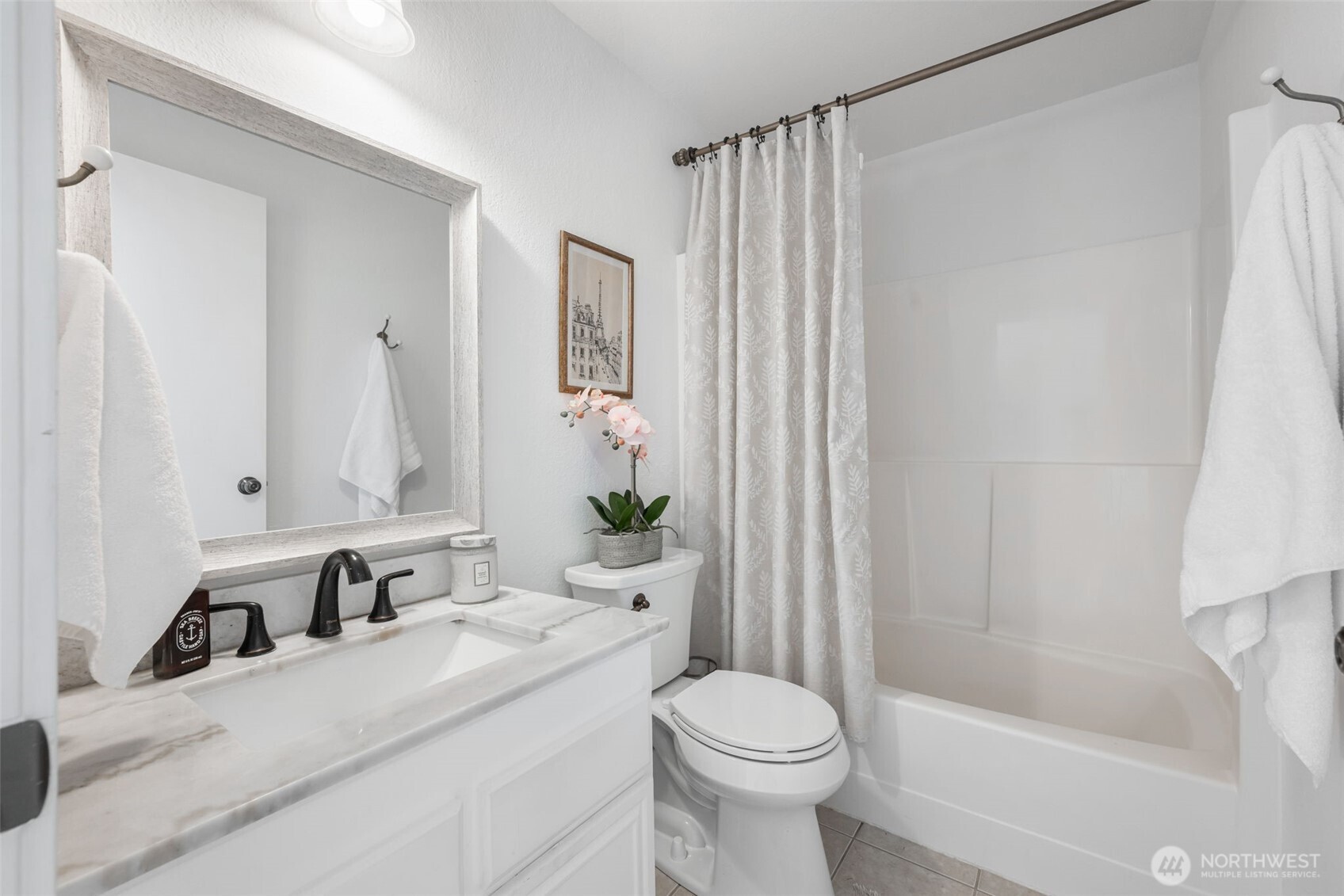 8017 196th Street Southwest, Unit 6B Edmonds, WA 98026 - Photo 15 of 23 a bathroom with a sink a toilet and shower