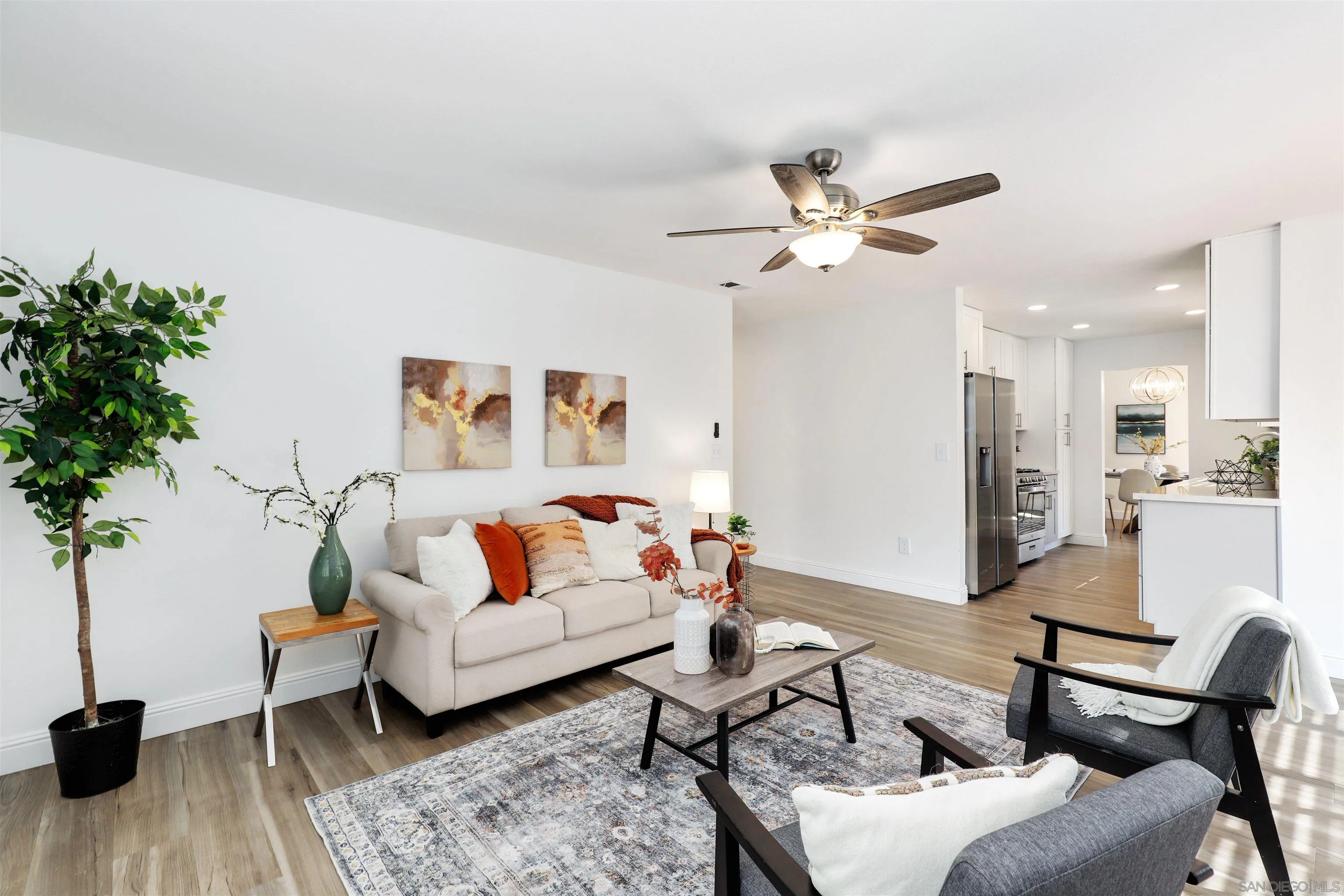 3933 Brown Street Oceanside, CA 92056 - Photo 11 of 25 a living room with furniture and a chandelier