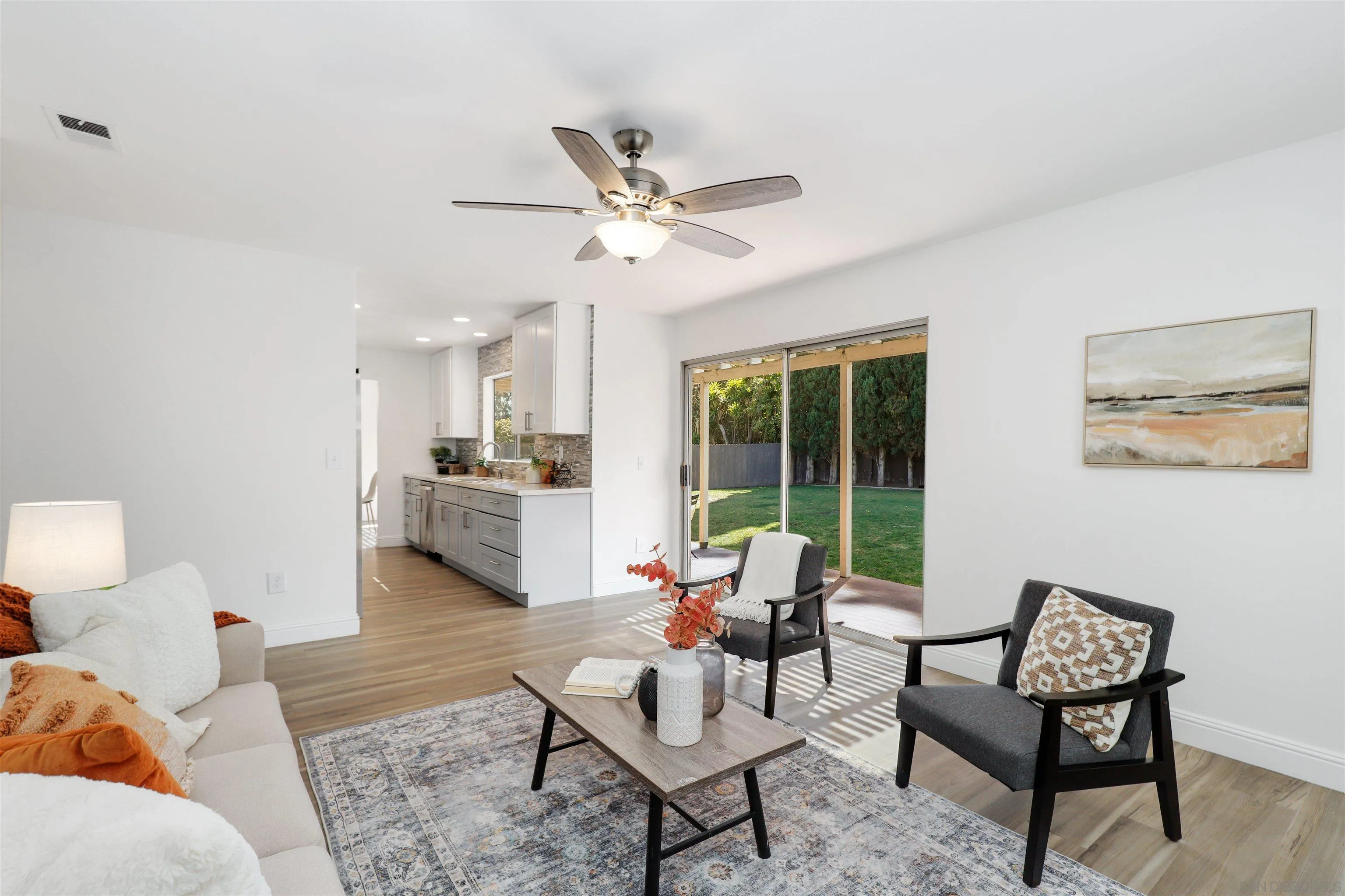 3933 Brown Street Oceanside, CA 92056 - Photo 12 of 25 a living room with furniture and a large window