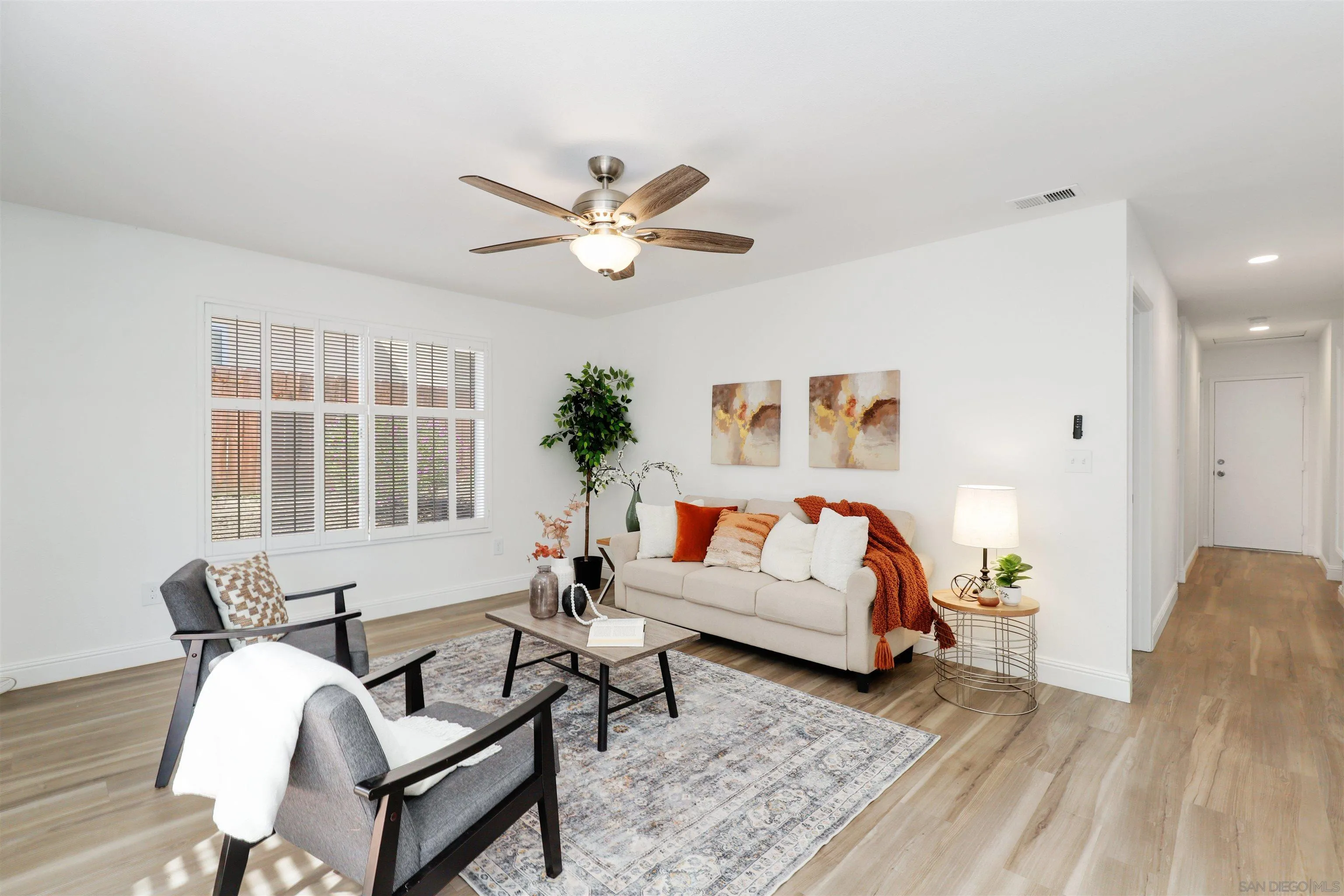3933 Brown Street Oceanside, CA 92056 - Photo 13 of 25 a living room with furniture and a large window