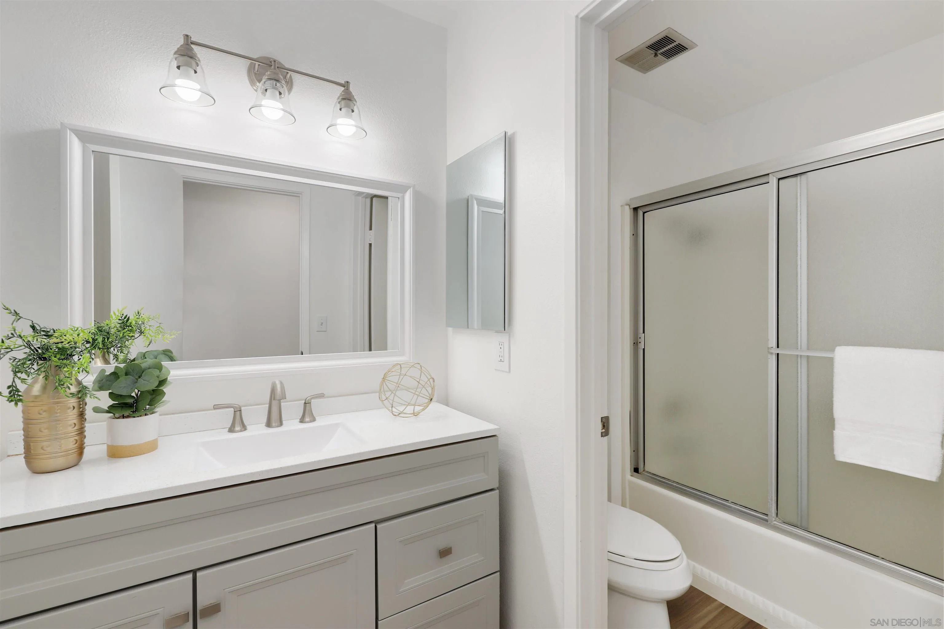 3933 Brown Street Oceanside, CA 92056 - Photo 16 of 25 a bathroom with a sink a toilet and shower