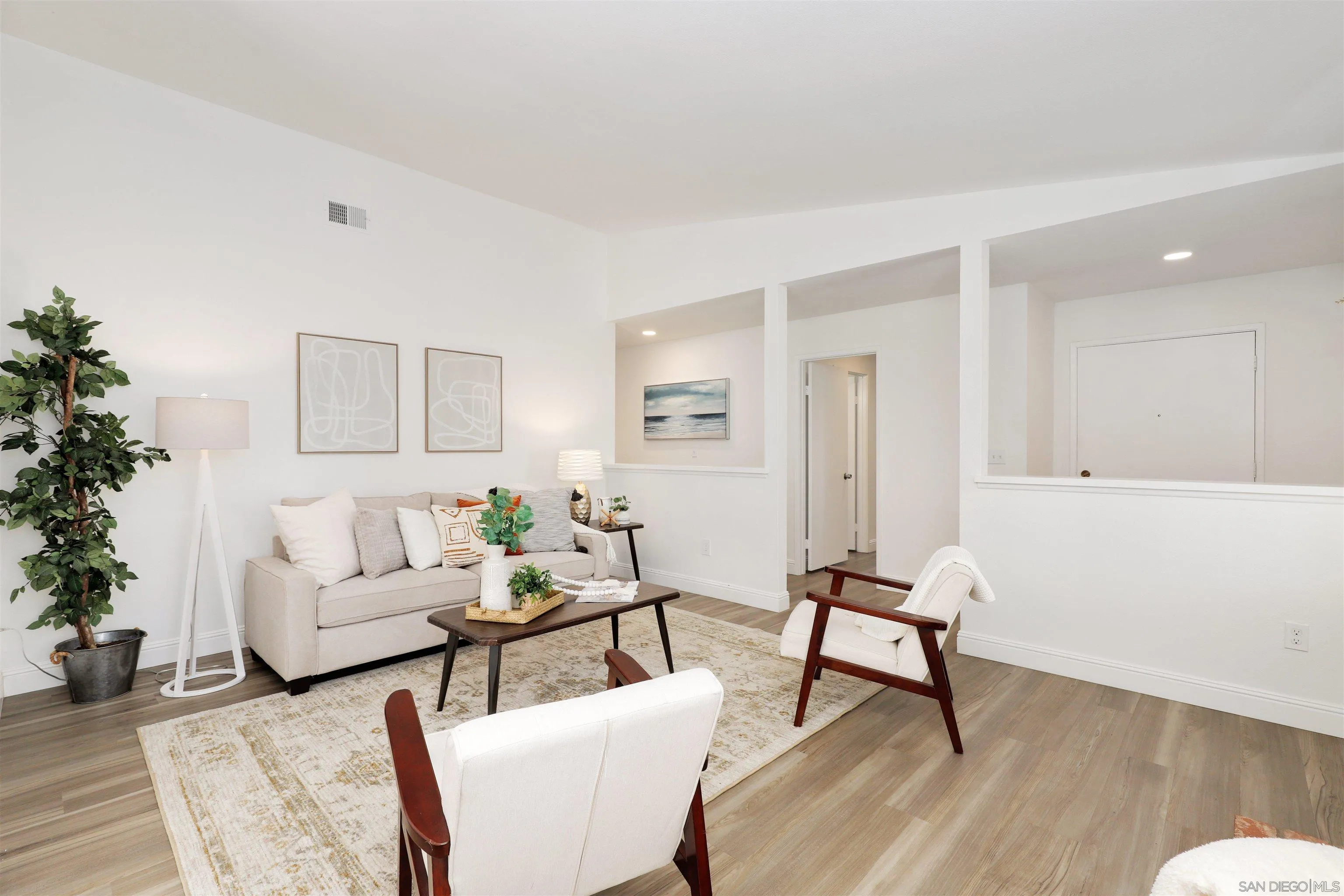 3933 Brown Street Oceanside, CA 92056 - Photo 2 of 25 a living room with furniture and wooden floor