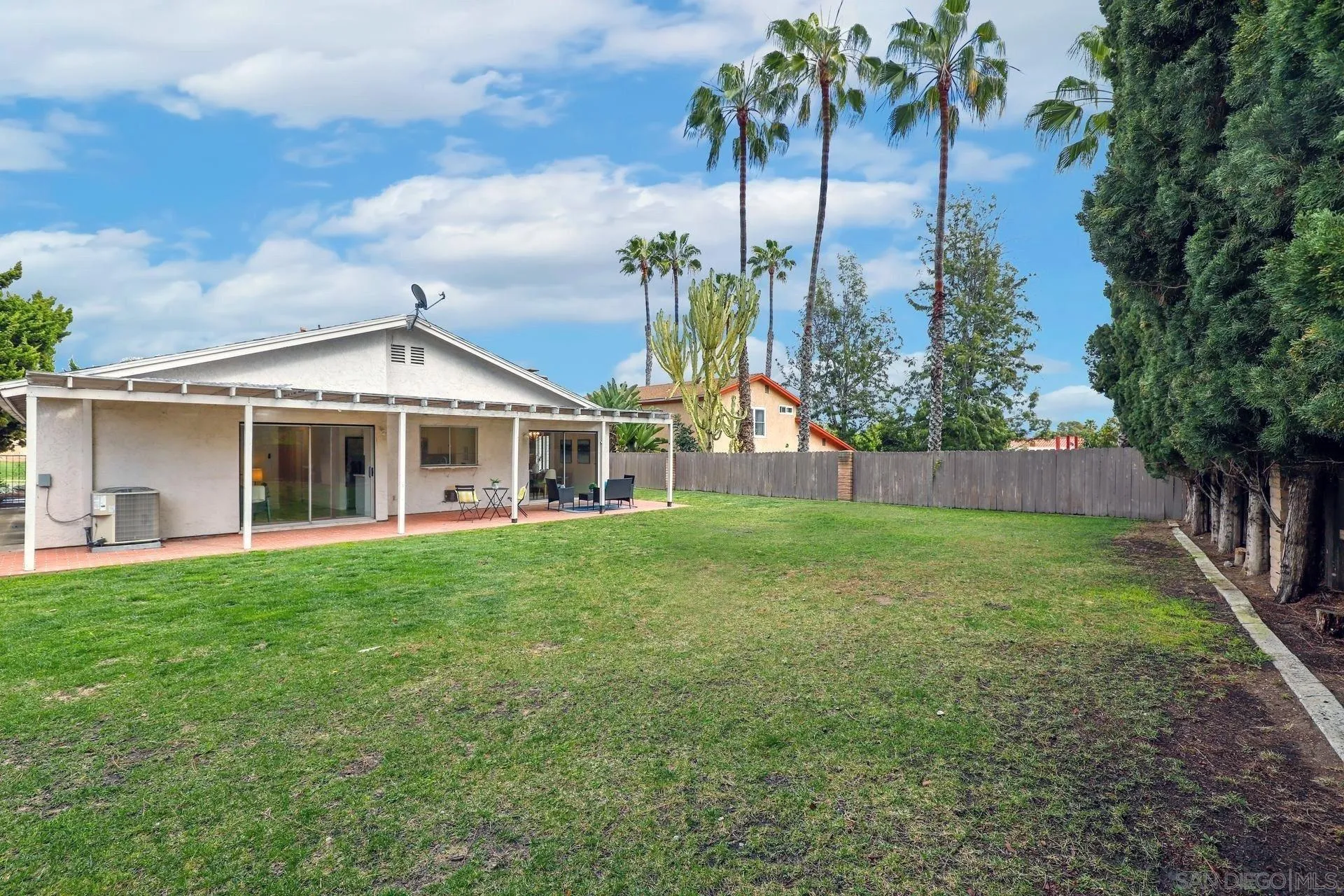 3933 Brown Street Oceanside, CA 92056 - Photo 23 of 25 a front view of a house with a garden