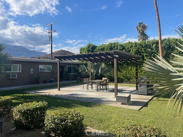a swimming pool with outdoor seating and yard