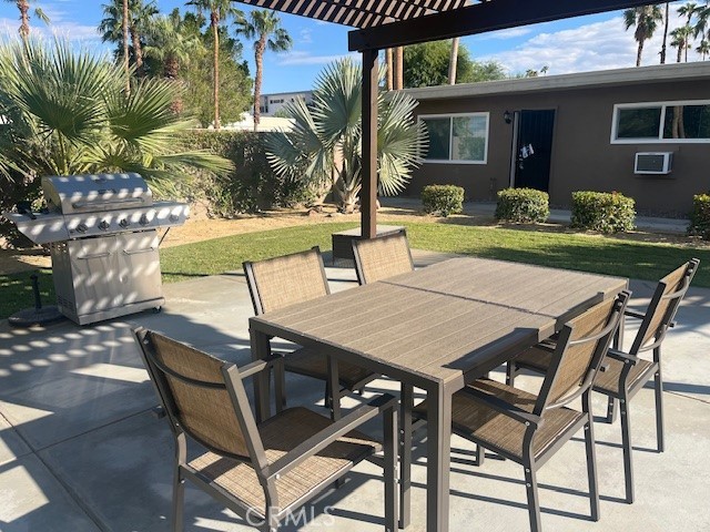 37067 Bankside Drive, Unit B Cathedral City, CA 92234 - Photo 22 of 23 a view of a patio with table and chairs and potted plants