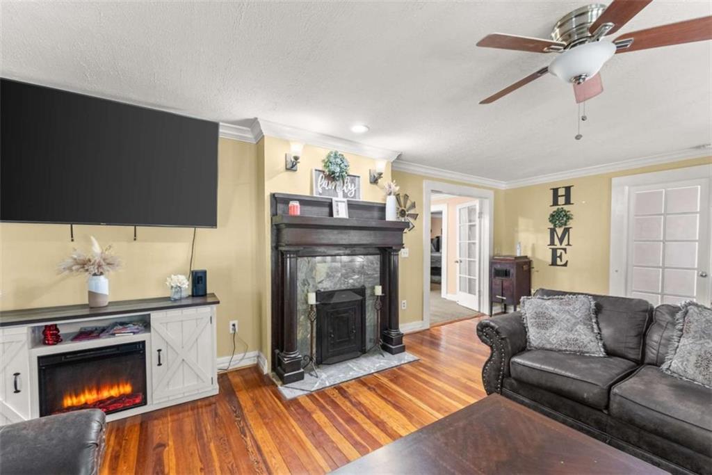 6622 Old Cleveland Road Clermont, GA 30527 - Photo 11 of 69 a living room with furniture and a fireplace