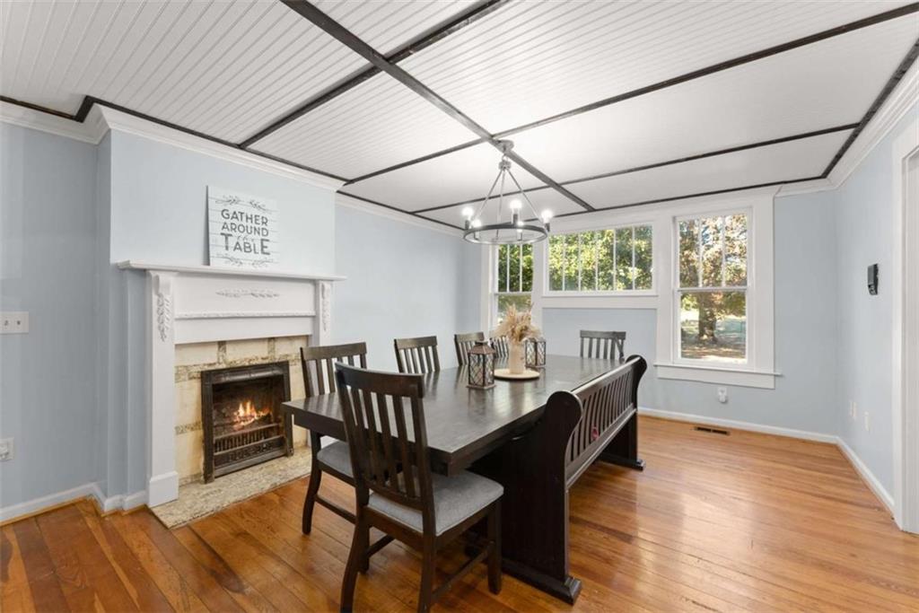 6622 Old Cleveland Road Clermont, GA 30527 - Photo 13 of 69 a view of a dining room with furniture window and wooden floor