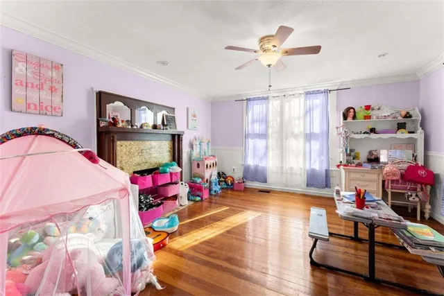 a bedroom with a large bed and a tv