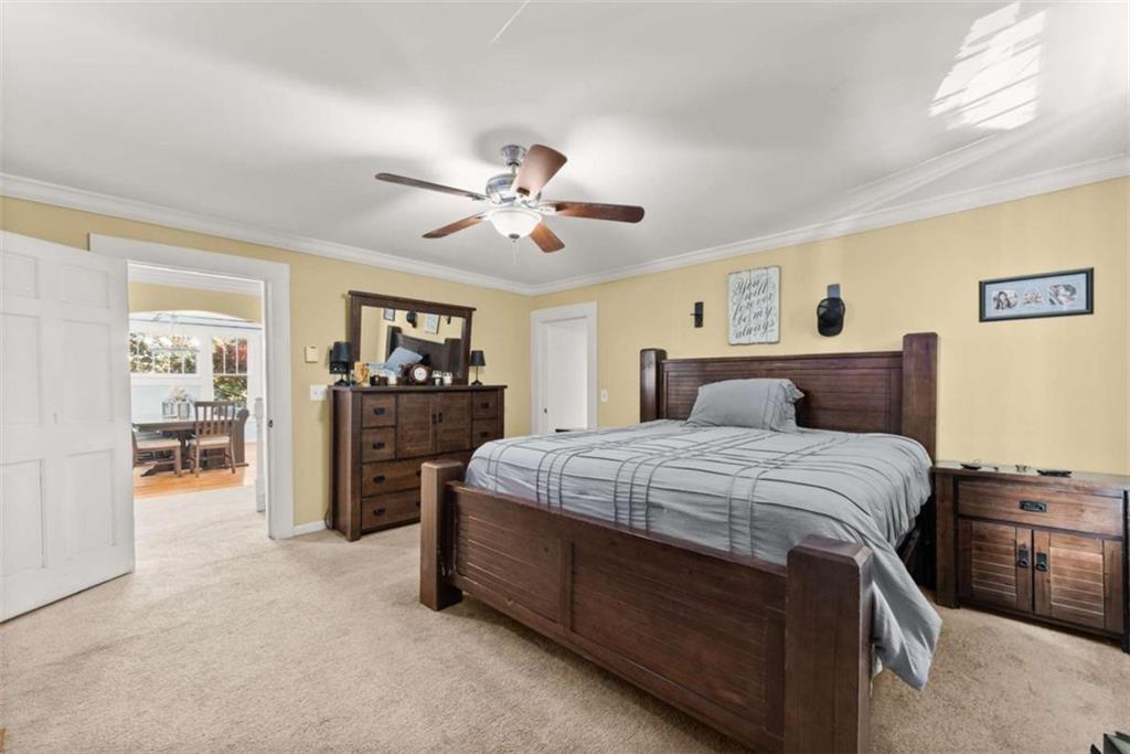 6622 Old Cleveland Road Clermont, GA 30527 - Photo 18 of 69 a bedroom with a large bed and a tv