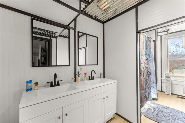 a large kitchen with a center island appliances and a counter top space