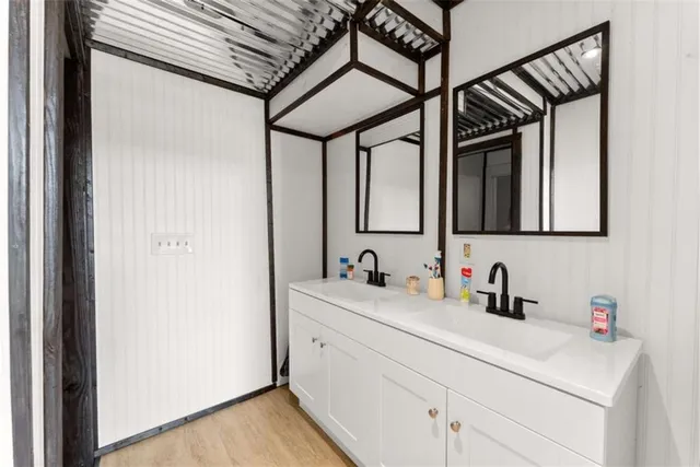 a living room with furniture and a open kitchen area