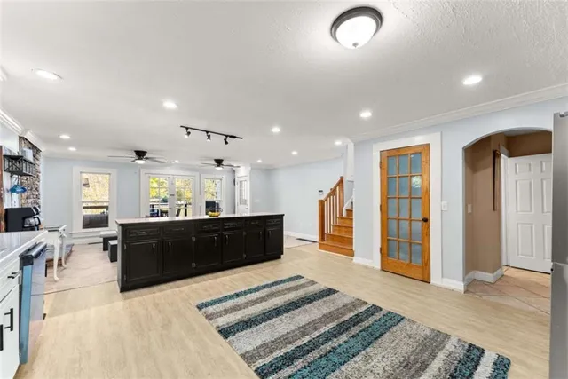 a bathroom with a sink mirror and toilet