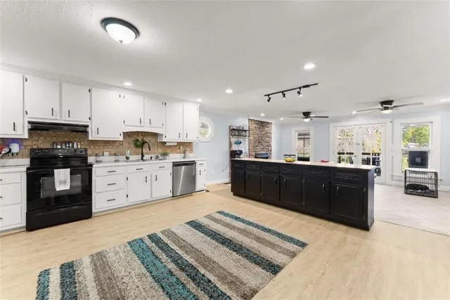 a bathroom with a sink mirror and a window