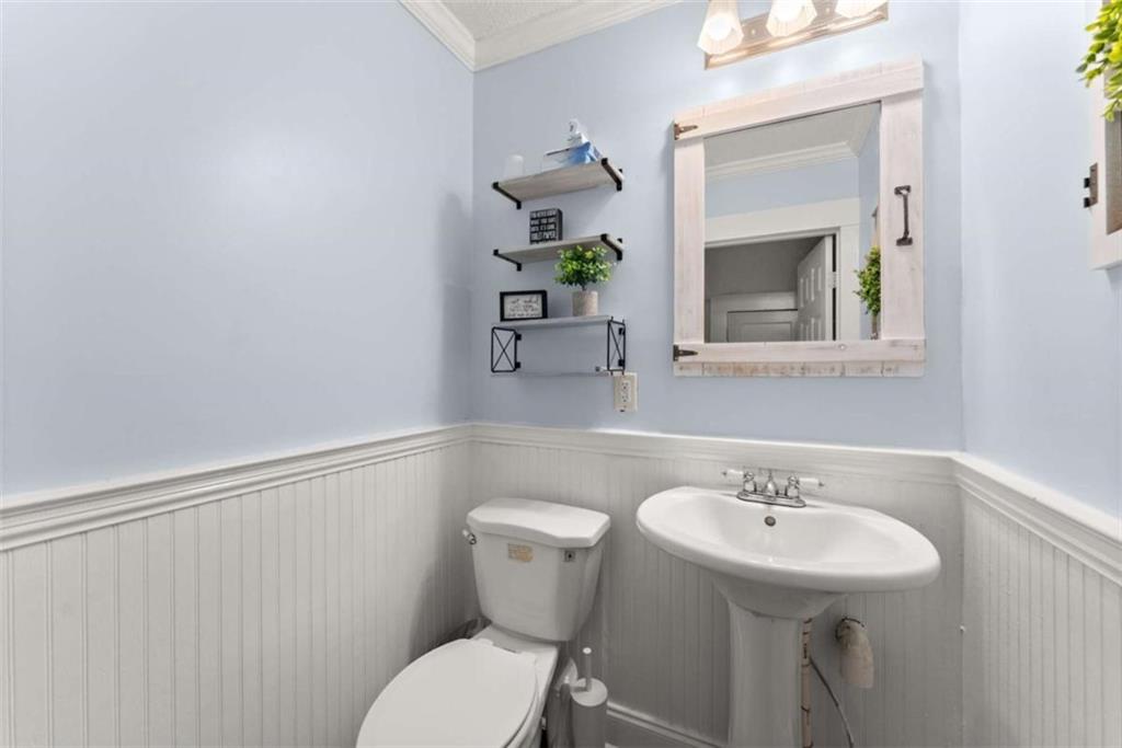 6622 Old Cleveland Road Clermont, GA 30527 - Photo 29 of 69 a bathroom with a sink mirror and toilet