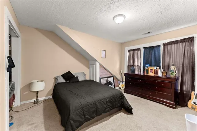 a car parked in front of a white house