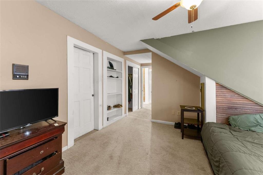 6622 Old Cleveland Road Clermont, GA 30527 - Photo 39 of 69 a living room with furniture and a flat screen tv
