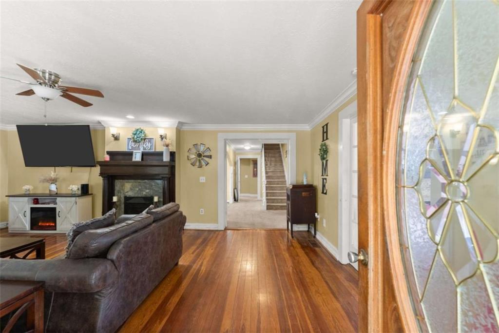 6622 Old Cleveland Road Clermont, GA 30527 - Photo 8 of 69 a living room with furniture and a fireplace